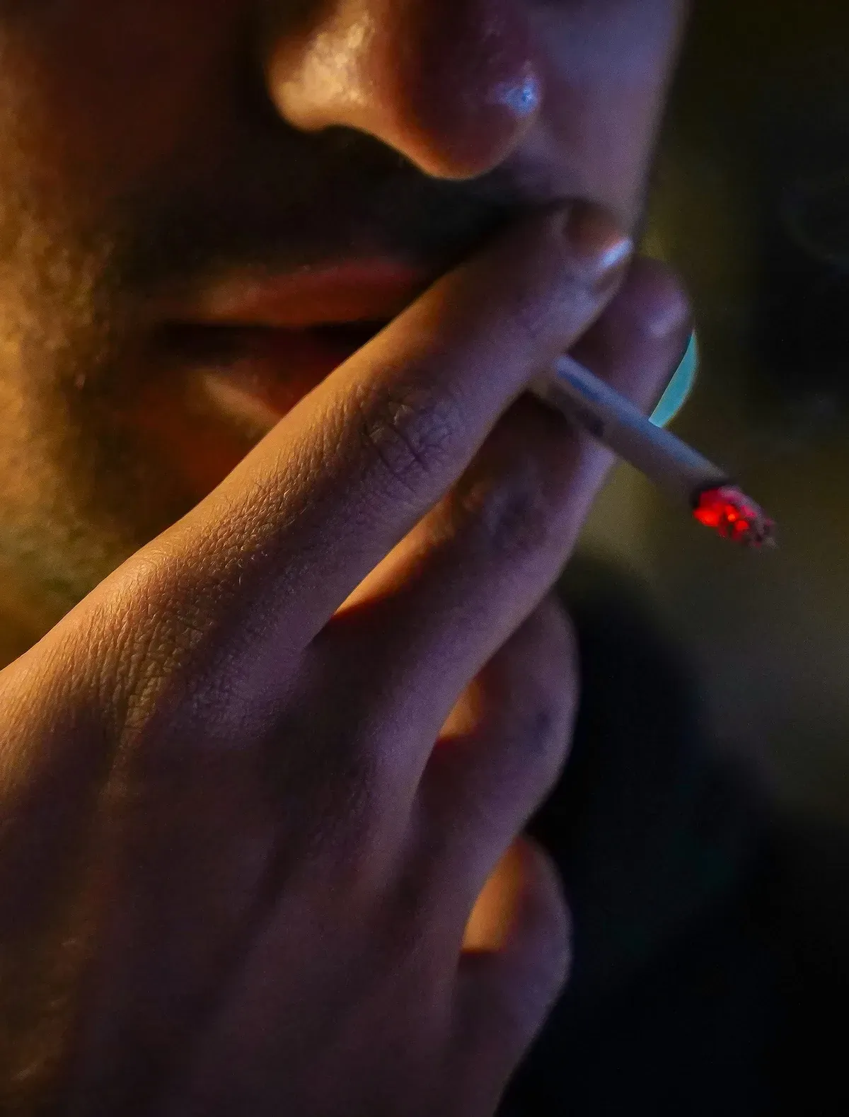 a person smoking a cigarette